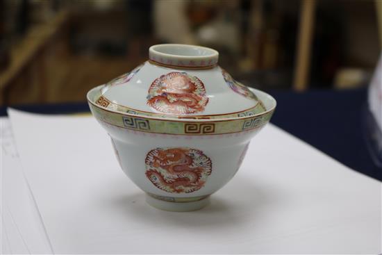 A Chinese celadon glazed dish, a Jun type tripod dish and a famille rose bowl and cover